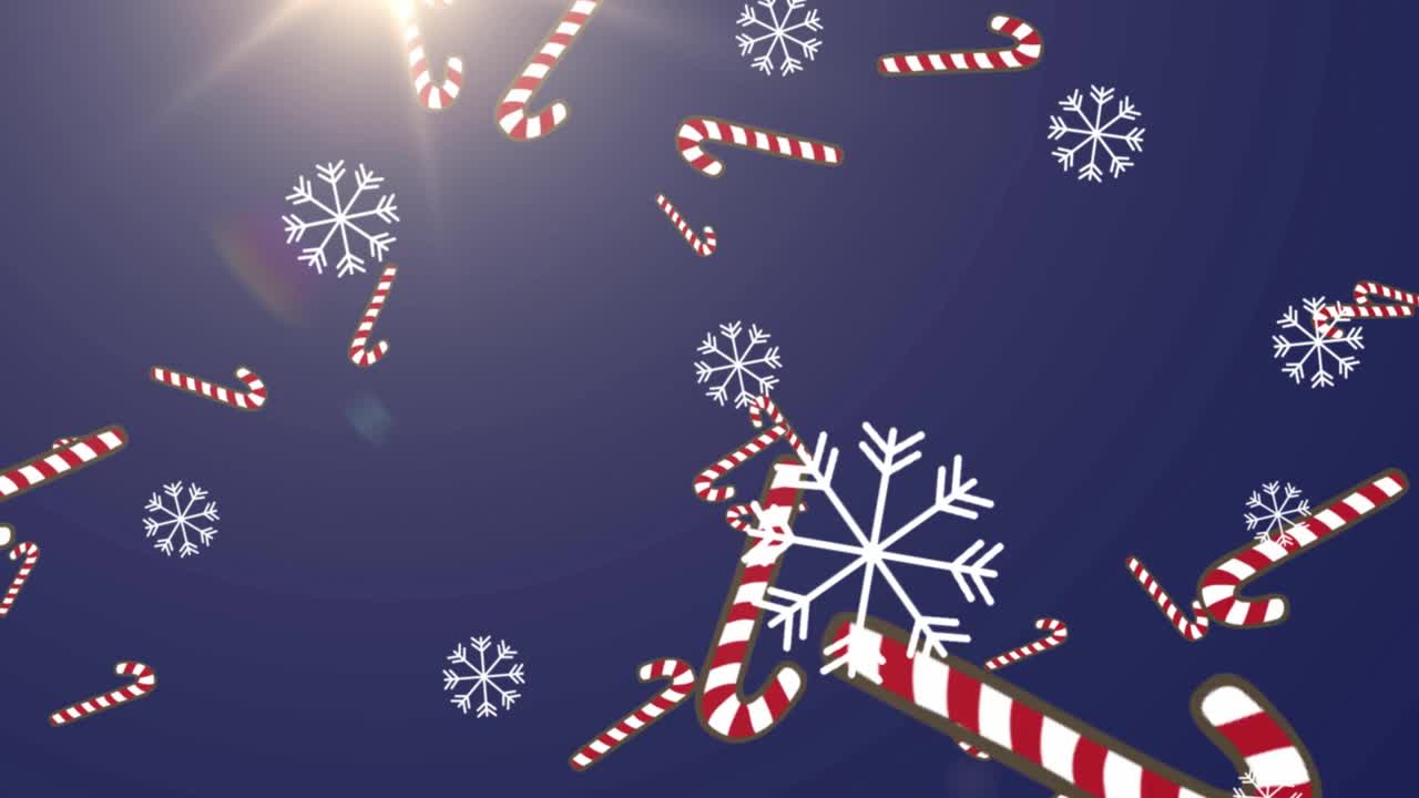雪花和糖果棒图标落在圣诞老人的雪橇由驯鹿拉视频素材