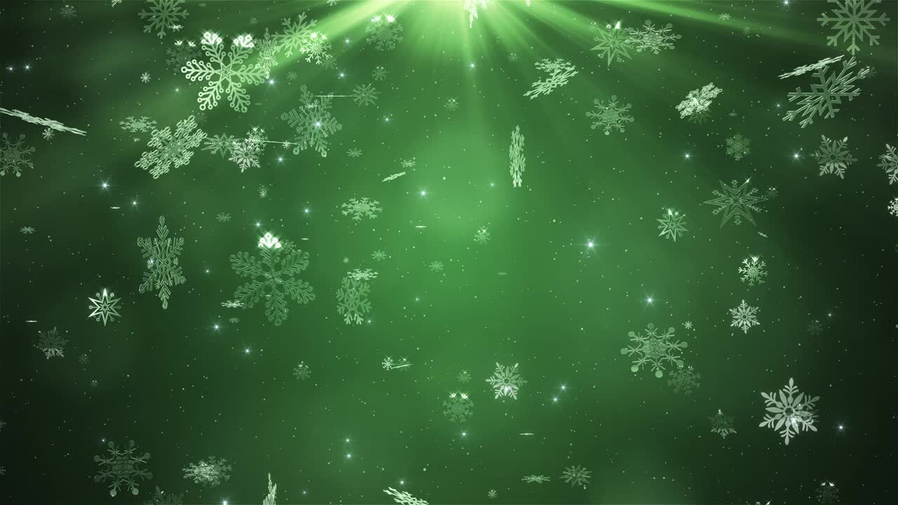 美丽的雪花落在绿色的背景上视频素材