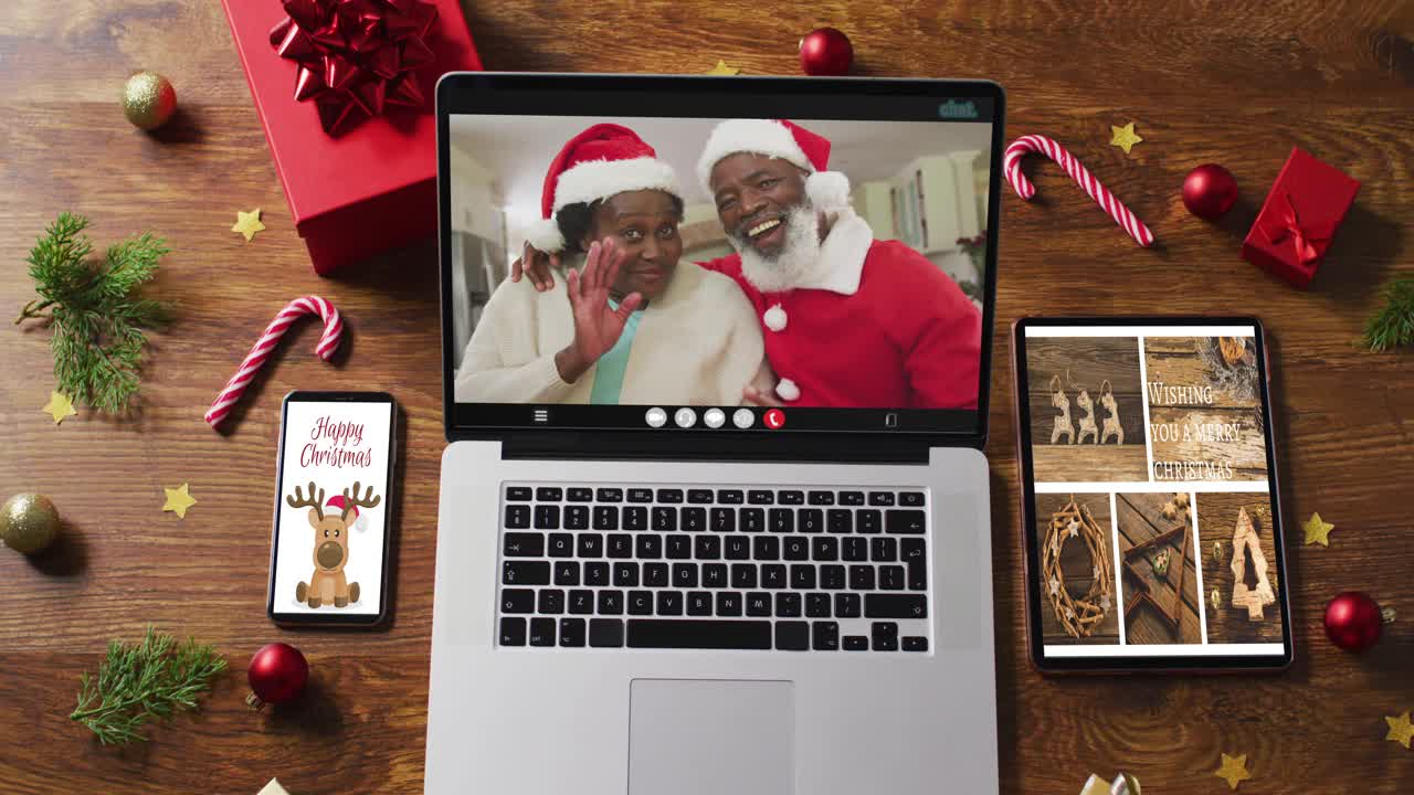 非裔美国老夫妇在笔记本电脑上视频通话，智能手机，平板电脑和装饰视频下载