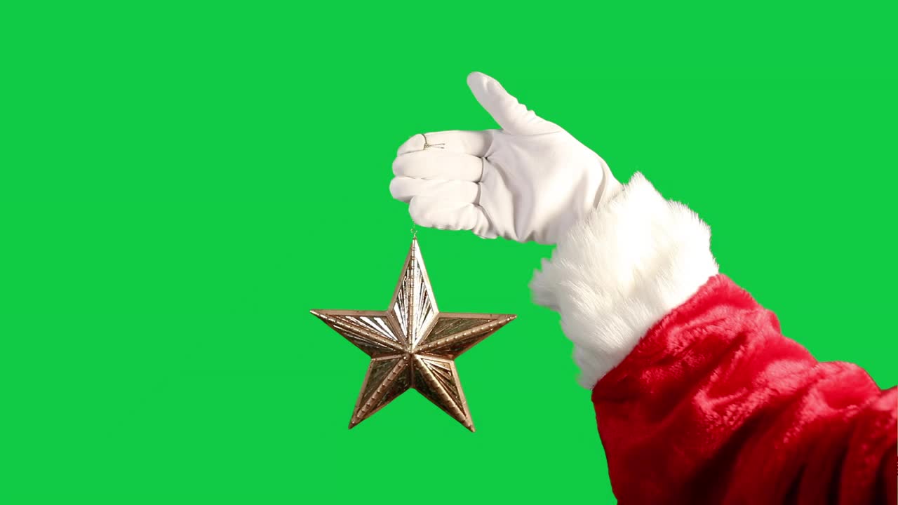 绿色屏幕上的圣诞老人手握金星装饰视频下载