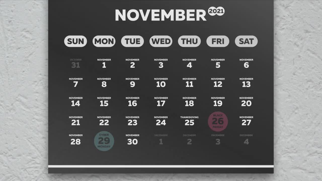相机放大了黑色星期五和网络星期一，标记着2021年挂历上美丽的黑色11月页面上的日期视频素材