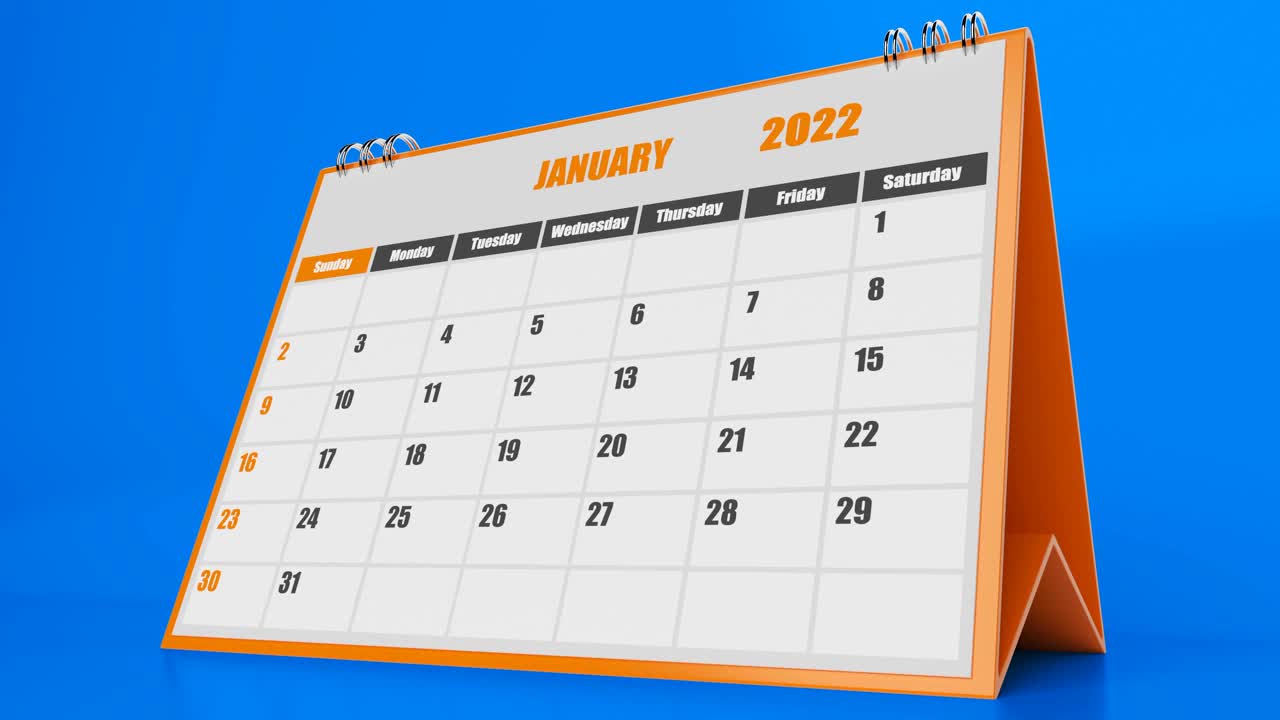 2022年日历飞行页与蓝色背景上的橙色视频素材
