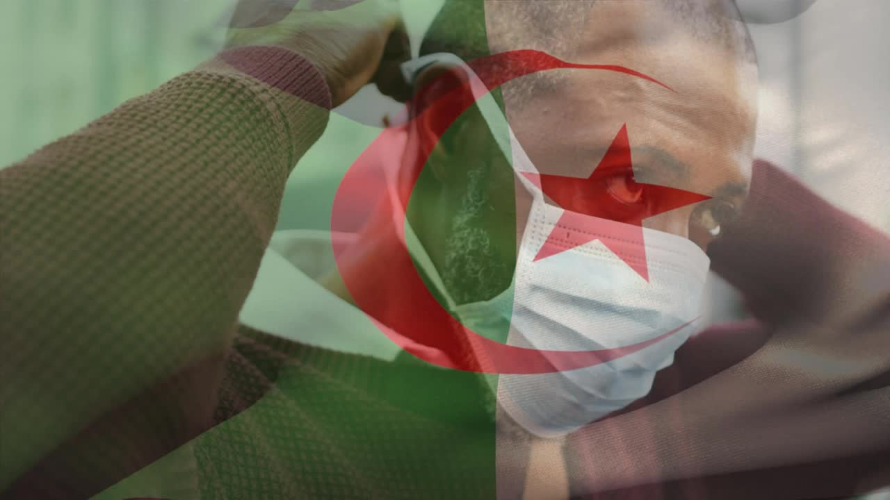 新冠肺炎大流行期间，阿尔及利亚国旗在戴口罩的男子面前飘扬的动画视频下载
