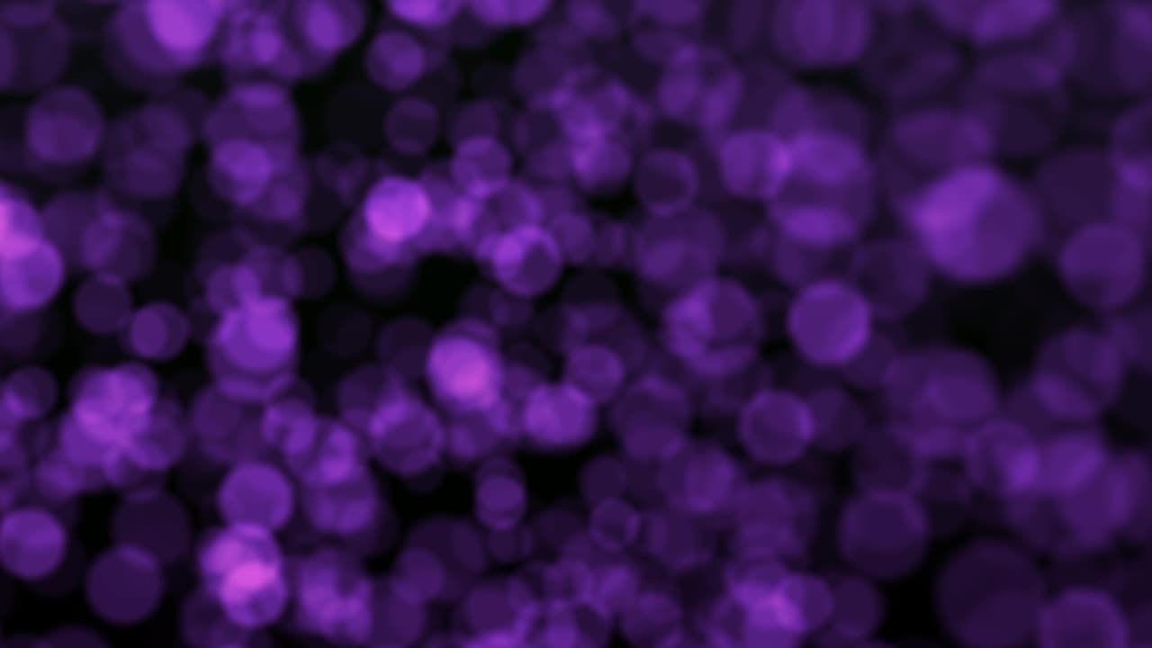 紫色抽象的光散景出焦点背景。抽象圆形灯光模糊背景。散焦发光点背景。优雅、细致、令人愉悦的散景和粒子视觉效果视频素材