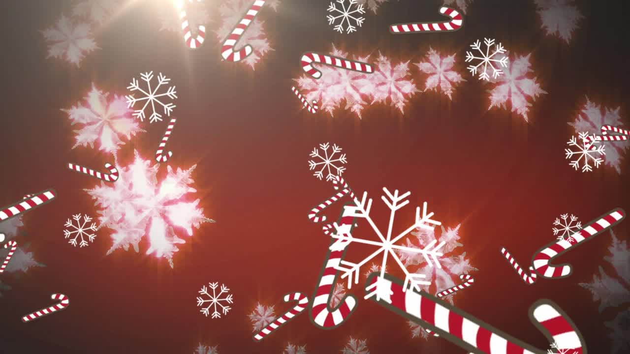 数字动画的多个糖果甘蔗图标和雪花落在红色的背景视频素材