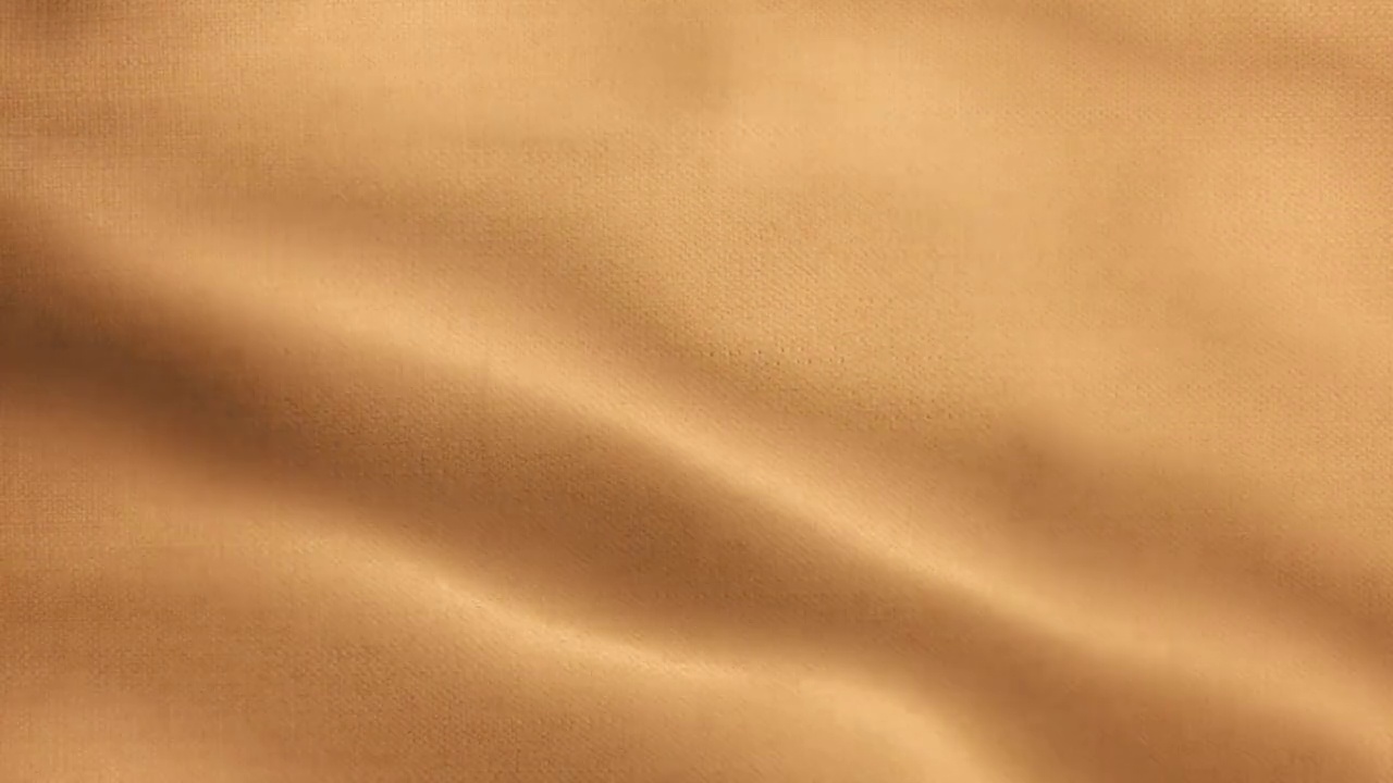 彩色空白挥舞和动画布旗纹理橙色背景可循环Stock视频-适用于位移地图使用-缎面织物动画视频素材