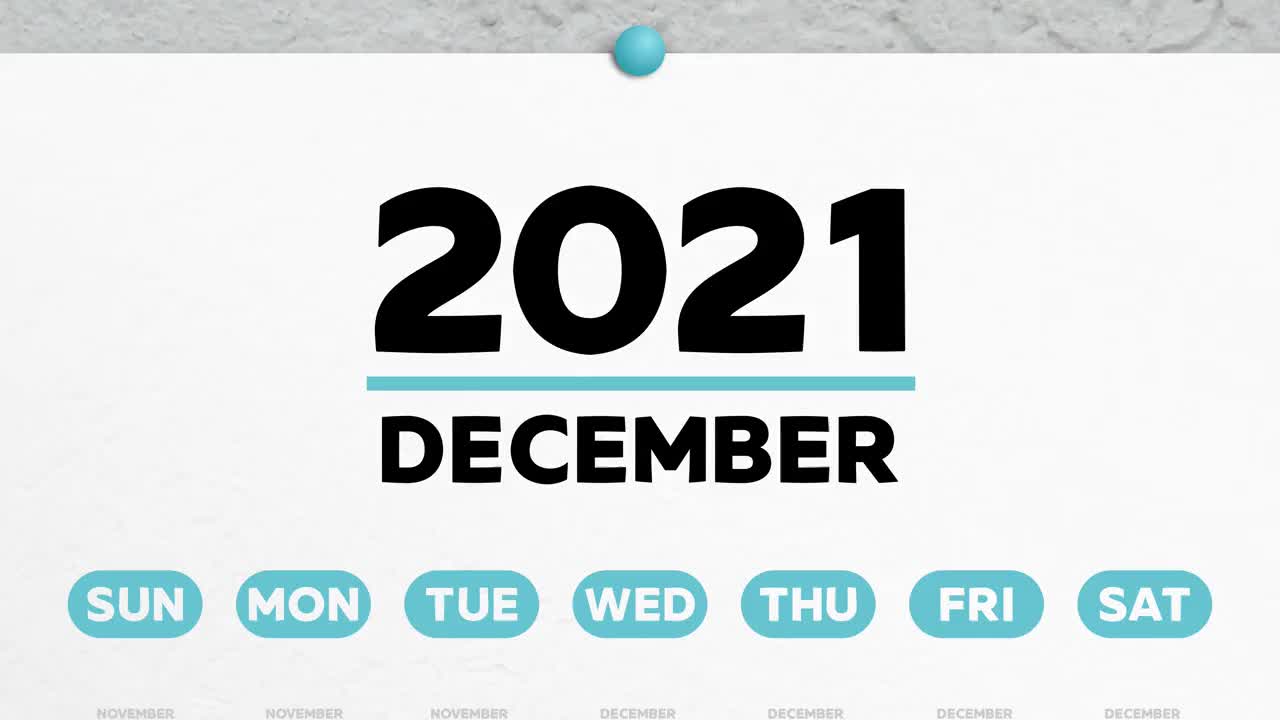 特写2021年日历美丽的12月页，镜头移到了标记的圣诞节日期视频素材