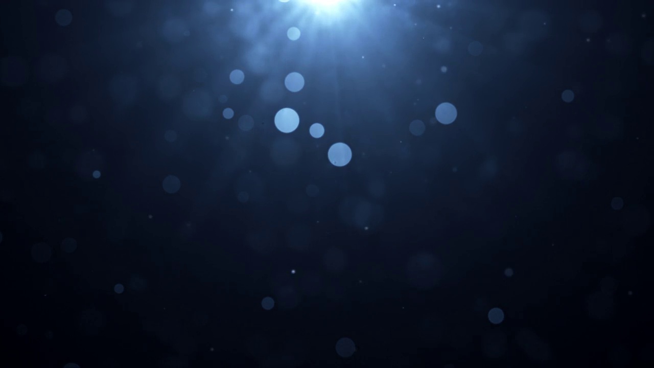 散焦的光和粒子在蓝色渐变水背景-可循环动画视频素材
