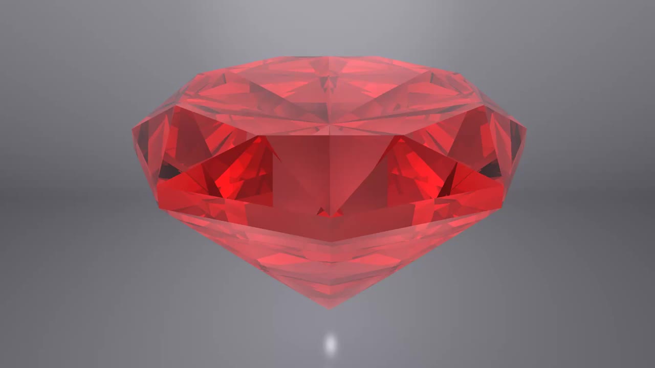 红色红宝石钻石放在灰色的背景上。视频下载