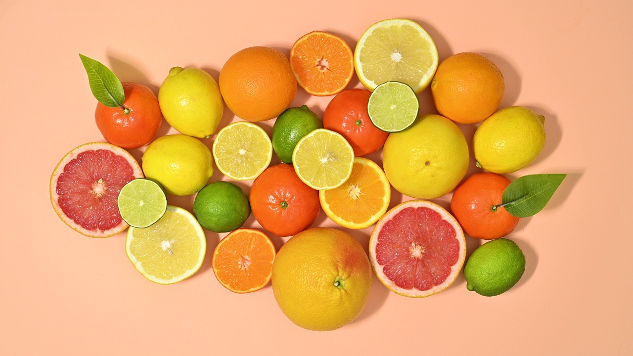 新鲜成熟的柑橘类水果馅，底色淡橙色。止动平铺视频下载