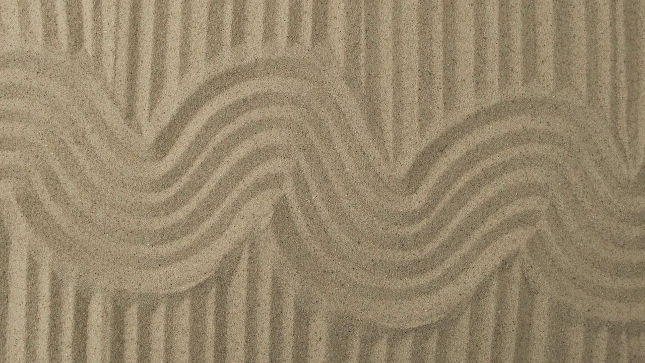 沙子纹理的旋转。弯弯曲曲和笔直的沙地。沙背景视频下载