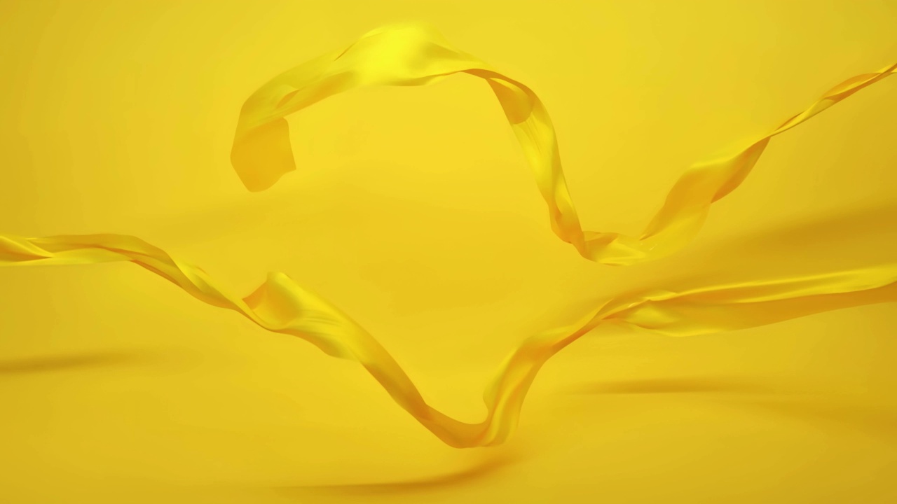 黄色织物衣服在风中飞舞，背景是黄色的慢动作视频下载