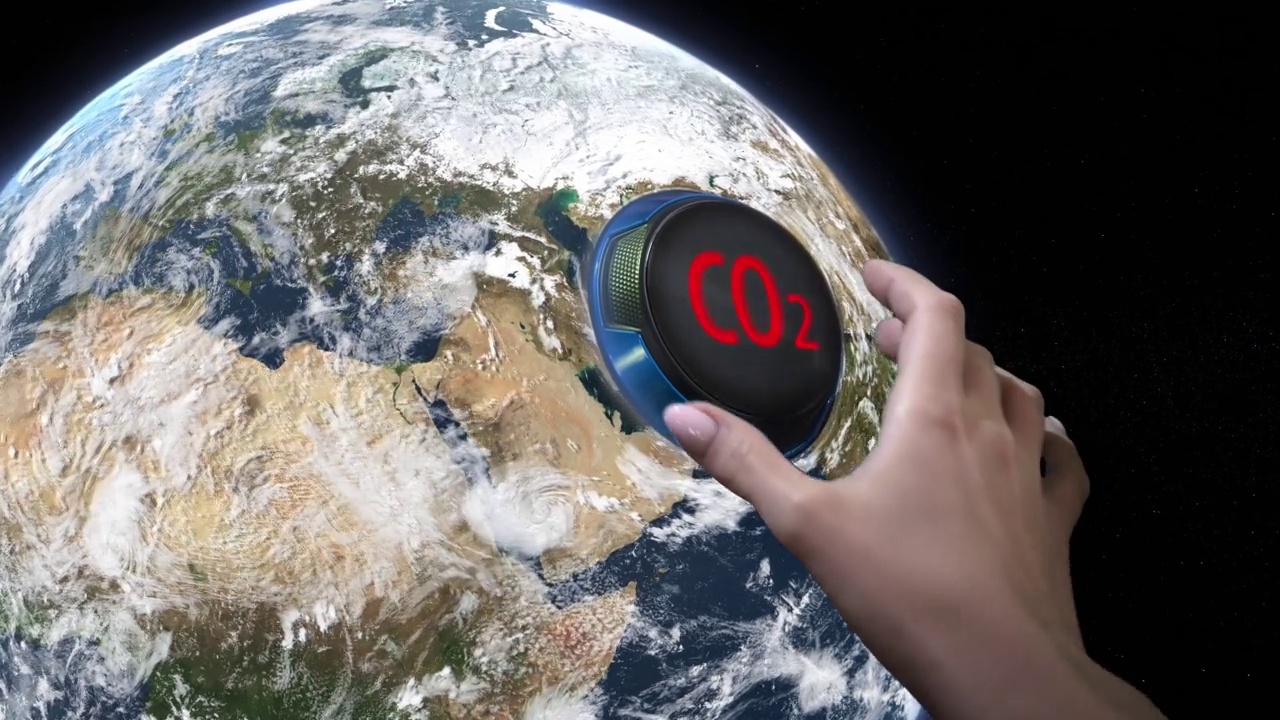 手转动地球手柄调节器，减少二氧化碳排放。减少碳足迹的理念。视频下载