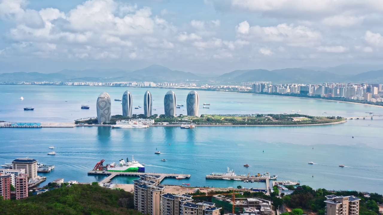 海南城市天际线和建筑与海洋自然风光的航拍镜头视频下载