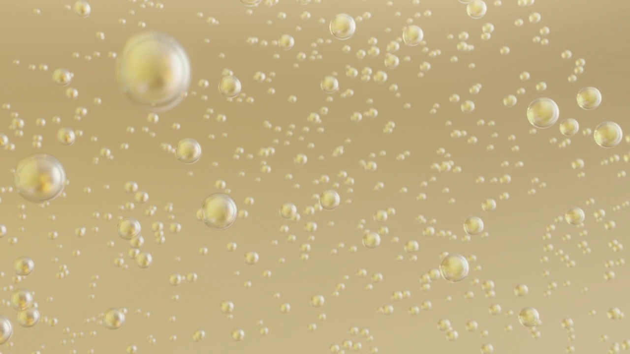 微距拍摄的各种黄金气泡在水中上升的光背景。视频下载
