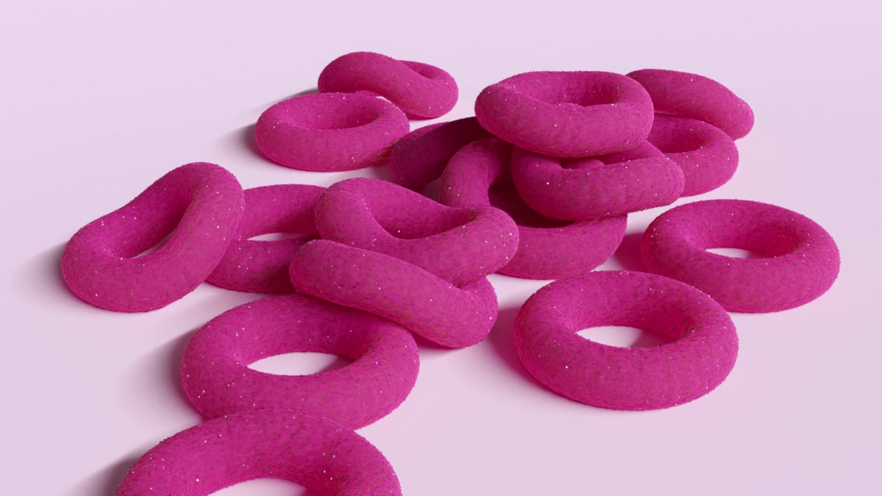 圆圆的粉红色果冻糖和糖落在桌子上特写。三维动画视频下载