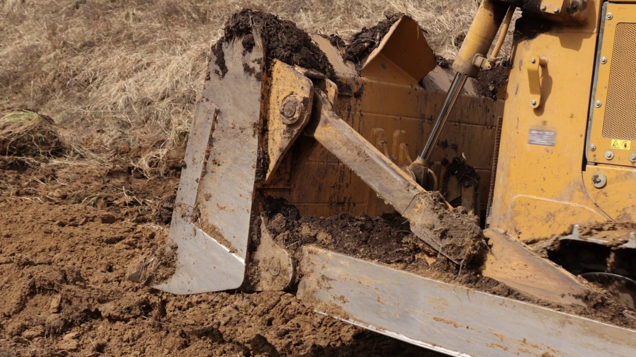 重型反铲工程机械设备概念。挖土机,推土机。黄色的装载机视频下载