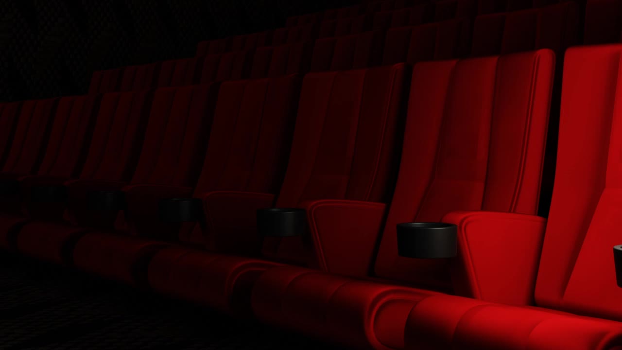 红丝绒影院的影院座椅用手推车跟踪拍摄运动摄影机的运动背景。艺术娱乐理念。视频素材