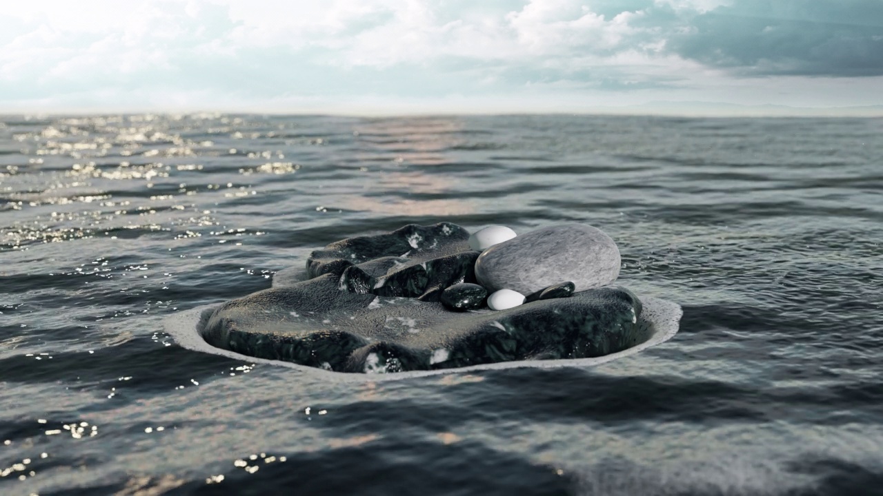 石头漂浮在海洋中，激起涟漪。视频素材