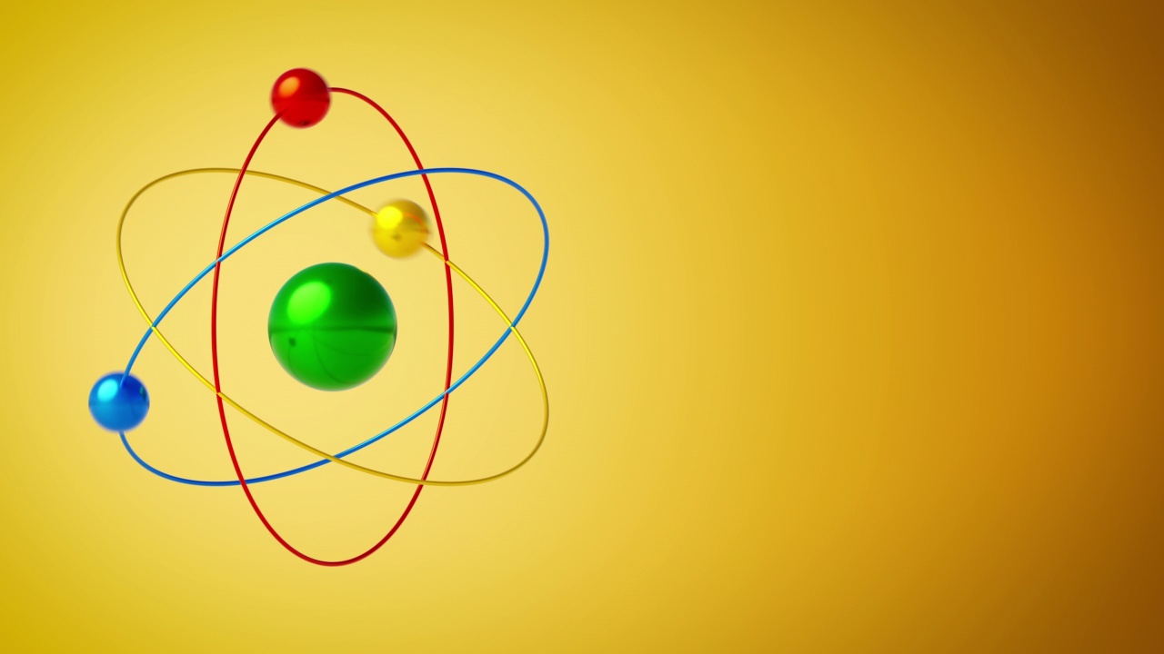 一个旋转的原子在橙色梯度背景和复制空间的特写。视频下载