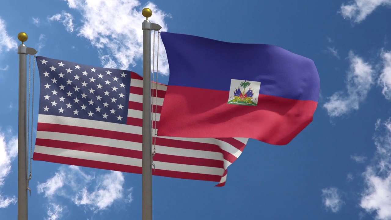 旗杆上插着美国国旗和海地国旗视频下载