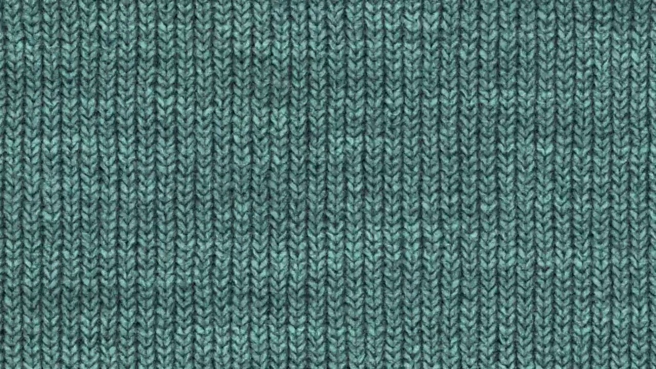 蓝绿色针织编织背景环。羊毛针织棉质地。织物材质布背景。视频下载