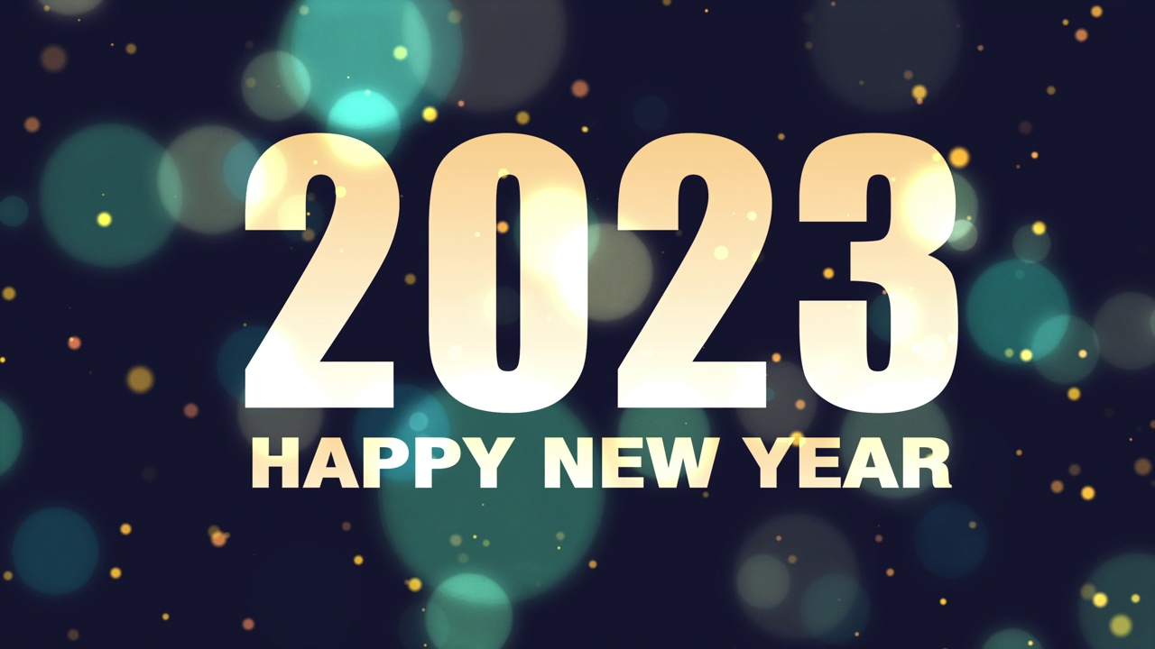 数字2022变成2023。2023年的庆祝概念与闪烁的粒子。散景灯。新年快乐的概念。视频下载