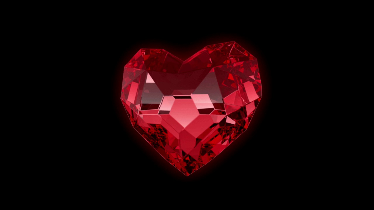 动画红色宝石心形漂浮孤立在黑色背景。视频下载