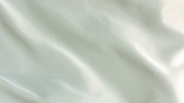 白色的丝织物随风飘荡，抽象的背景视频素材