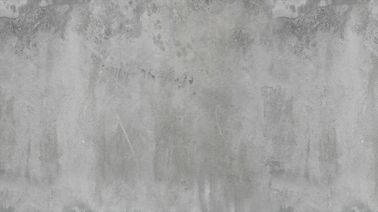 圆形的软枕头在混凝土墙的背景下相互碰撞。深浅灰色。视频下载