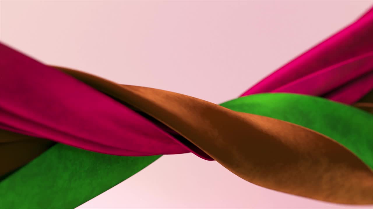 不同颜色的丝绒丝带在抽象的背景上紧紧地缠绕在一起。绿色、棕色、紫色。视频下载