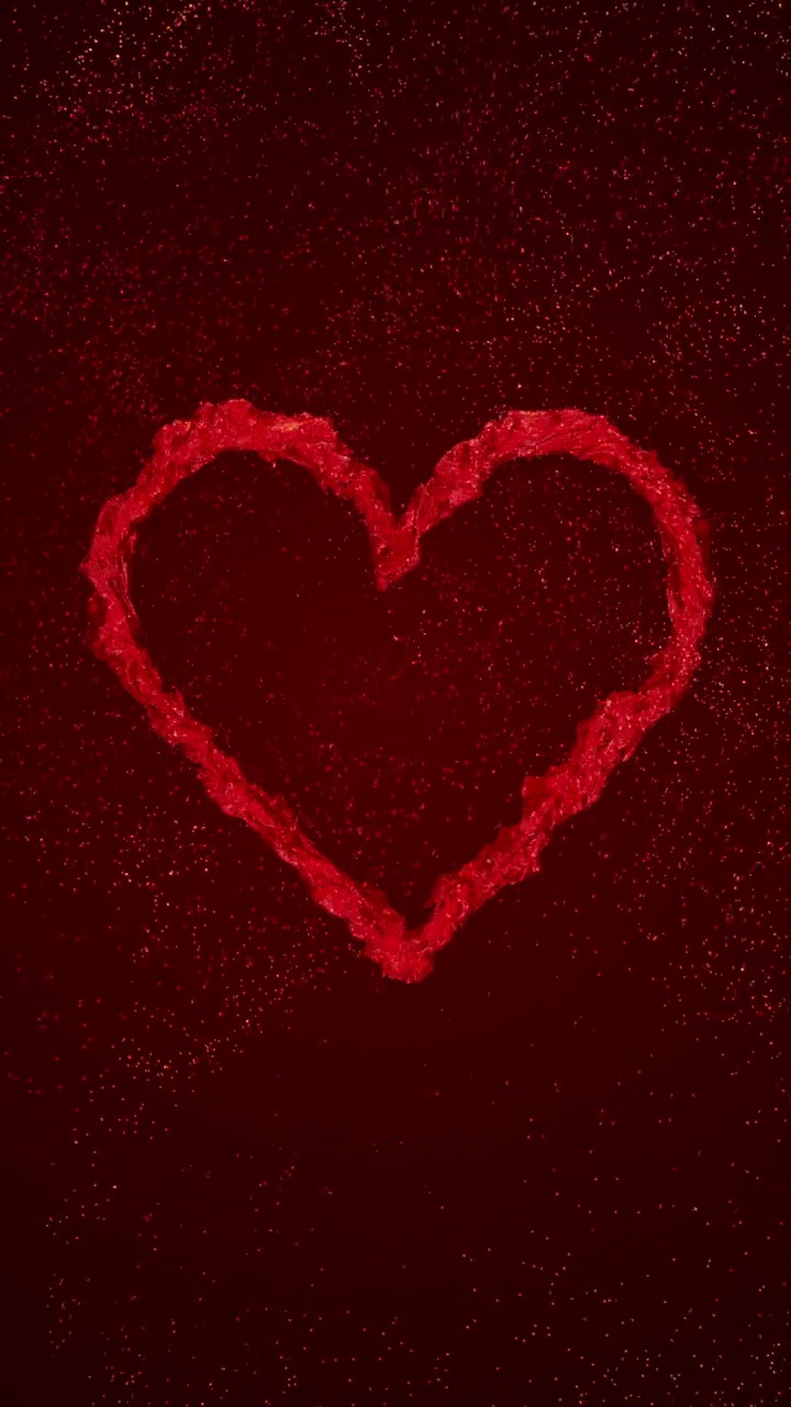 红色液体心脏旋转的红色背景与流动的粒子视频素材