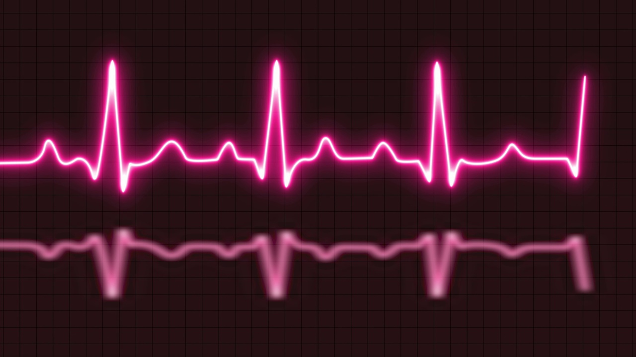心电图或心电图图，心电图心跳热脉冲发光红色霓虹灯循环动画背景视频下载