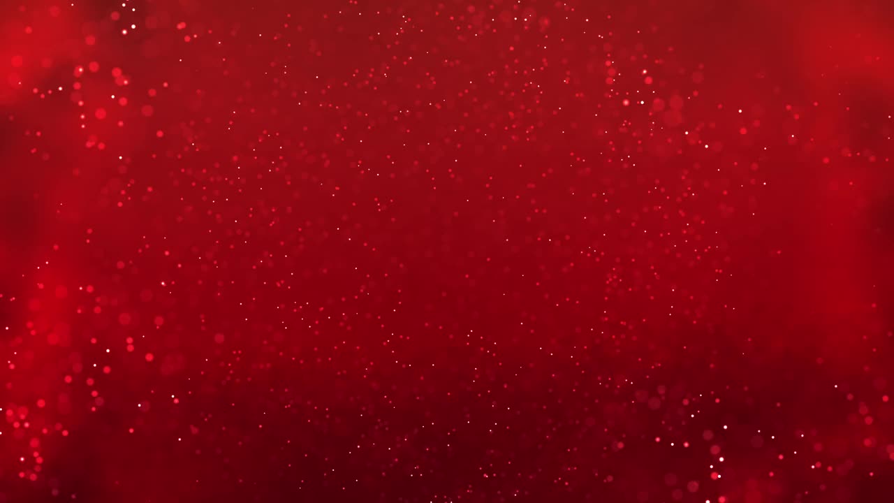 粒子抽象背景与散景的红色背景。视频下载