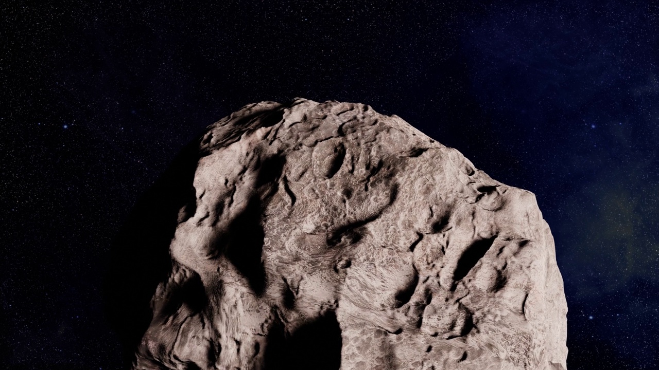 一颗小行星正在太空中移动和旋转视频下载