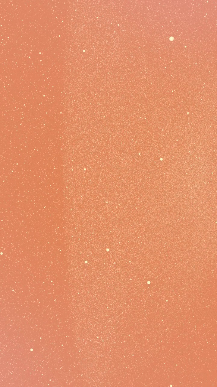 沙米色的小点在橙色珊瑚渐变的背景上闪闪发光，形成了一个抽象的形象。垂直星星背景派对或圣诞假期和新年的概念与复制空间视频下载