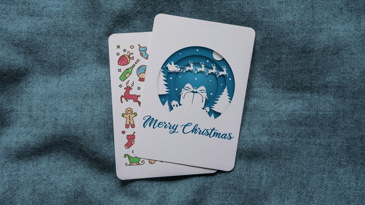 蓝色彩色剪纸风格的圣诞老人和飞行驯鹿动画与大礼盒和圣诞快乐的文字垂直圣诞卡视频下载