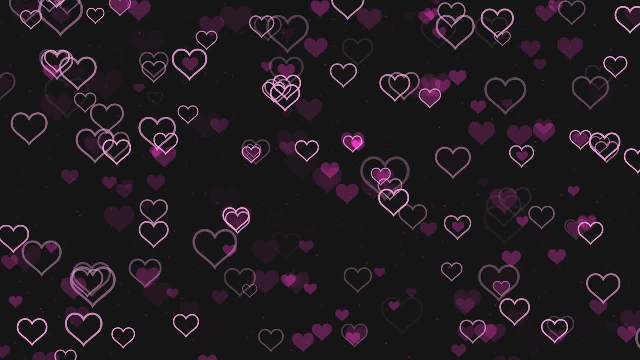 浪漫的粉红色的心跳动在黑色的背景视频下载