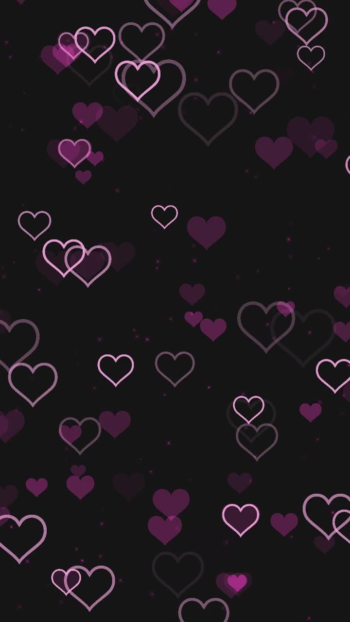 浪漫的粉色心在黑色背景上跳动视频下载