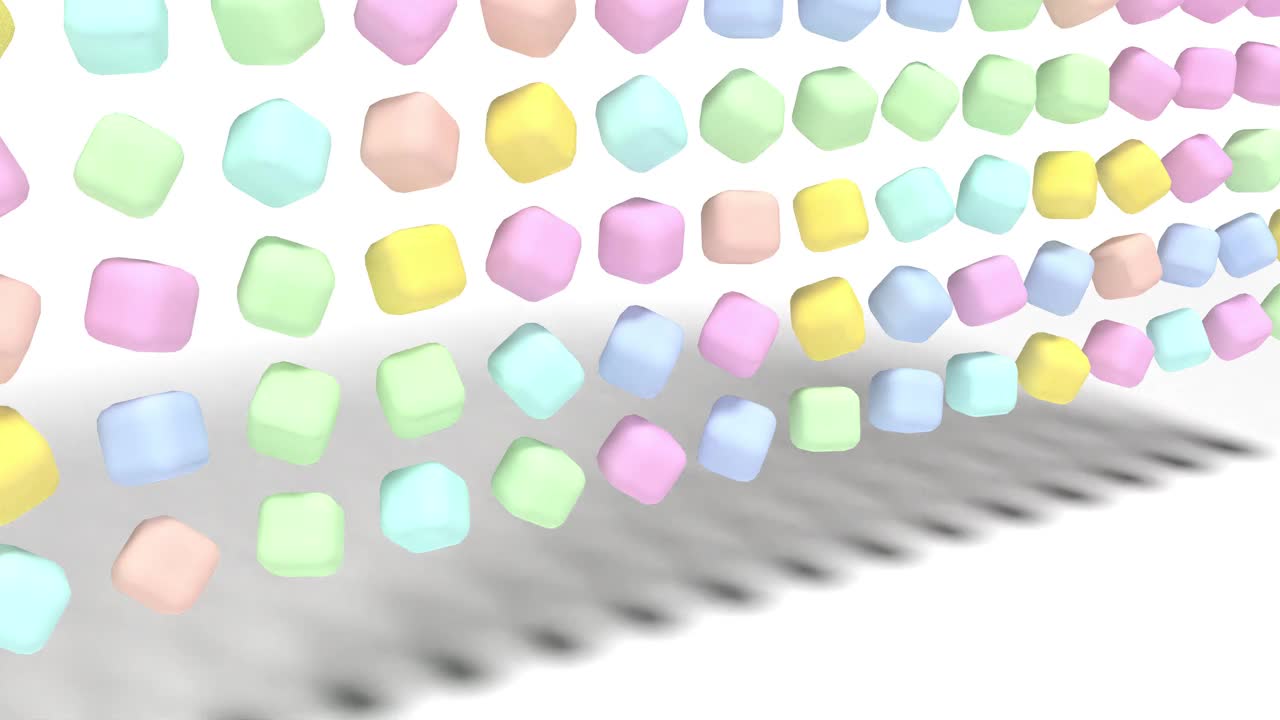 色彩柔和的糖果糖果落在白色的表面上视频下载