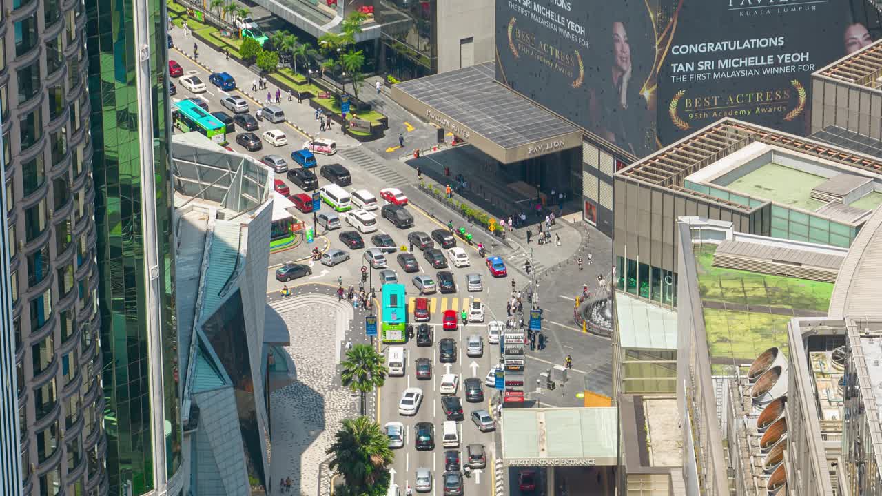 晴朗的白天，吉隆坡市著名的中央交通街广场航拍全景4k延时马来西亚视频下载