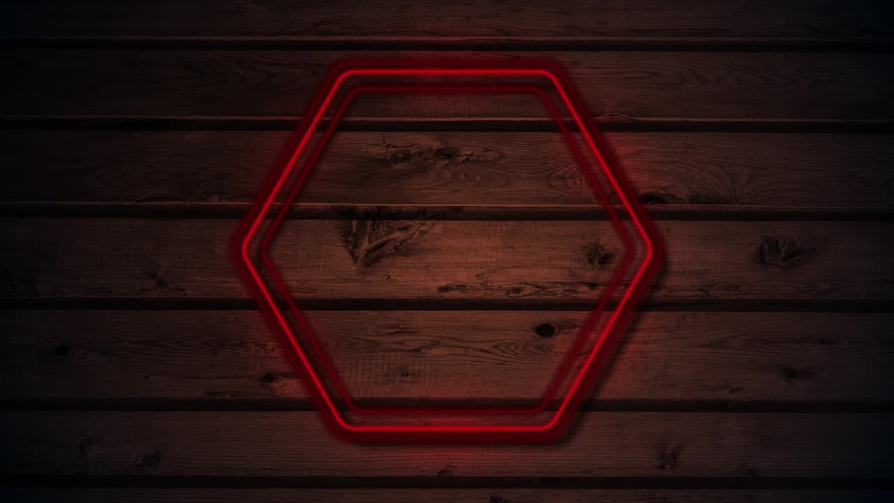 红色霓虹灯发光六角形框架上的深色木制抽象背景视频下载