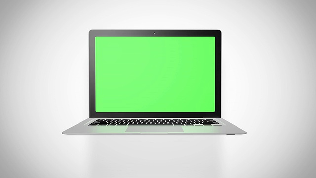 笔记本电脑绿色屏幕，白色背景视频素材