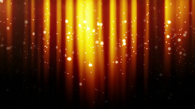 金粒子在光束中环绕飞行视频素材