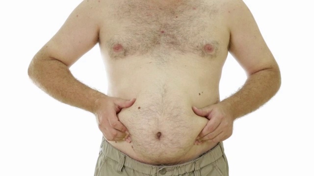 肥胖男子挤压腹部的腰部视频素材