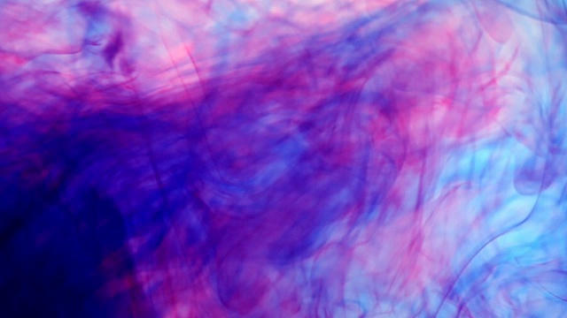 彩色墨水在水里滴在白色的背景上视频素材