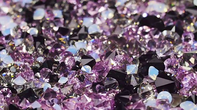 许多暗紫色宝石钻石旋转的背景视频下载