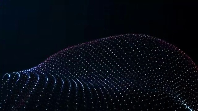 从发光粒子的非晶态表面的变形，表面的球形起伏，未来形状的抽象动画视频素材