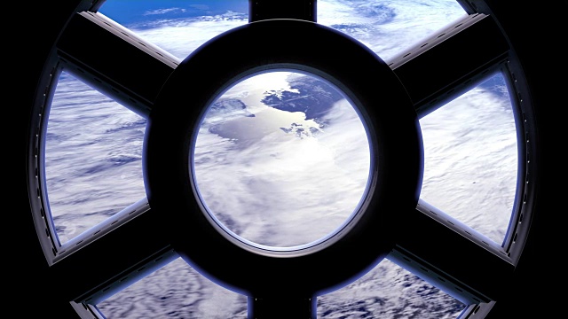 透过国际空间站的窗户看到的地球。视频下载