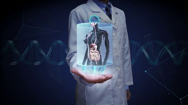 医生摊开手掌，放大女性人体器官扫描，消化系统。蓝色的x射线。视频素材
